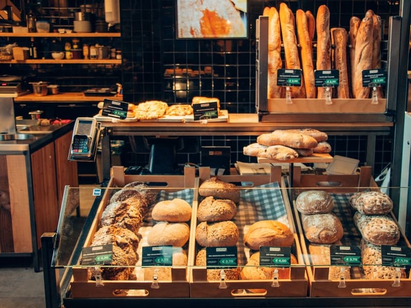Inside The Bakery Banús: fresh bread on the counter and in the display